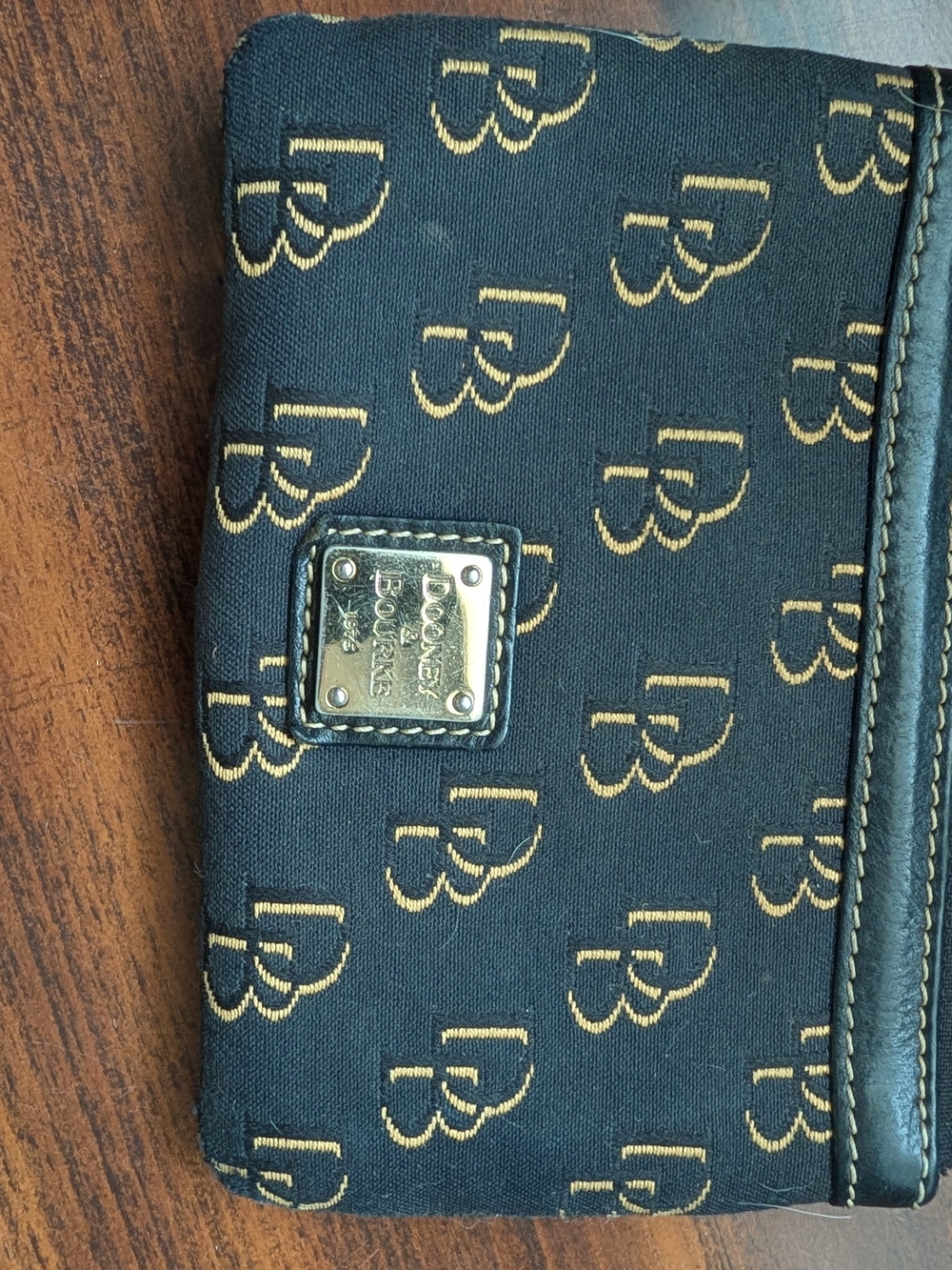 Dooney & Bourke Black and Gold Monogram Wristlet